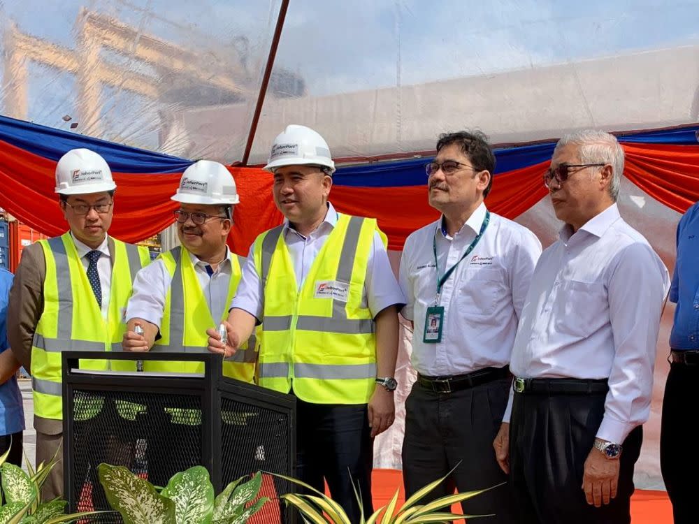 Transport Minister Anthony Loke Siew Fook (centre) officiates Johor Port Berhad’s milestone volume handling of one million Twenty-Foot Equivalent Unit (TEU) for 2019 December 16, 2019. — Picture by Ben Tan