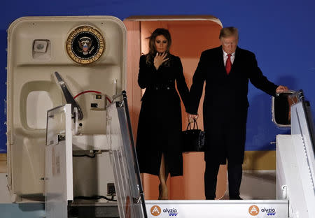 U.S. President Donald Trump and first lady Melania Trump exit Air Force One as they arrive at Orly Airport near Paris to attend commemoration ceremonies for Armistice Day, 100 years after the end of the First World War, France, November 9, 2018. REUTERS/Christian Hartmann