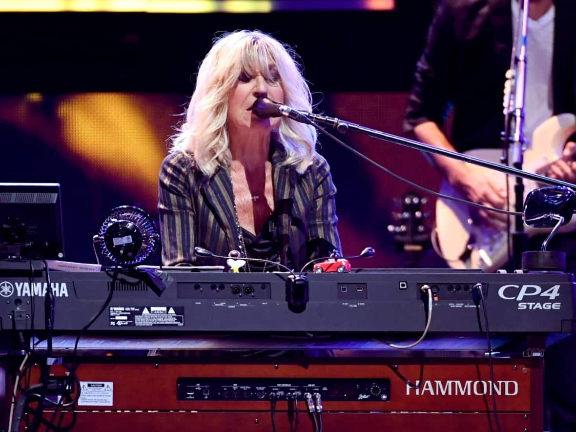 Christine McVie, of Fleetwood Mac, performs during the iHeartRadio Music Festival at T-Mobile Arena in September 2018 in Las Vegas. McVie died Wednesday after a short illness, her family said. She was 79. (Kevin Winter/ Getty Images - image credit)