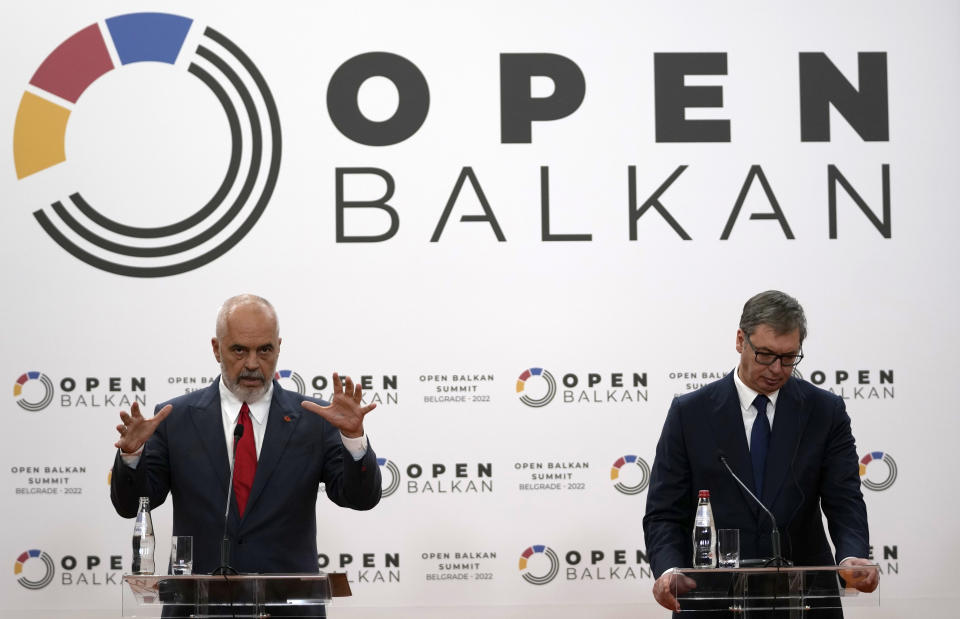 Serbian President Aleksandar Vucic, right, listens Albanian Prime Minister Edi Rama during a press conference after the "Open Balkan" economic forum for regional cooperation in Belgrade, Serbia, Friday, Sept. 2, 2022. (AP Photo/Darko Vojinovic)