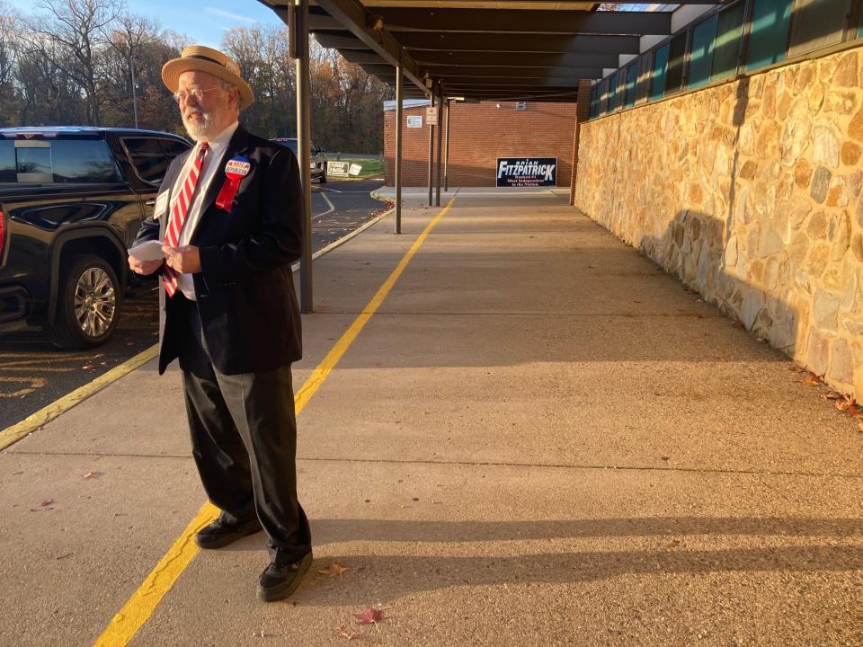 Ralph McClellan, GOP committeeman in Middletown, greets early morning voters at Samuel Everitt Elementary School in Levittown. He’s manned the polling place every election since 1988.