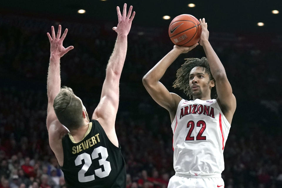 Arizona forward Zeke Nnaji (22) shoots over Colorado forward Lucas Siewert during the second half of an NCAA college basketball game Saturday, Jan. 18, 2020, in Tucson, Ariz. Arizona won 75-54. (AP Photo/Rick Scuteri)