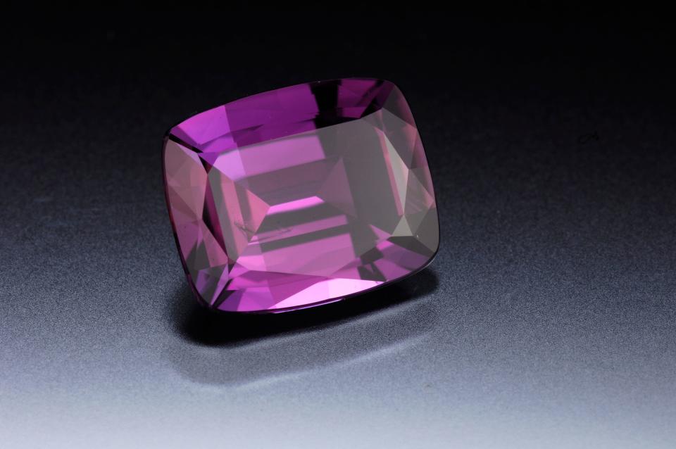 Alexandrite is one of three birthstones for the month of June. Alexandrite comes from a rare variety of mineral that changes color depending on lighting. This gem can appear green or blue in daylight or fluorescent light. In incandescent light, it can appear red or purple. Alexandrite often represents luck and prosperity. 