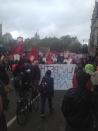 Unite members march under grey skies in London.