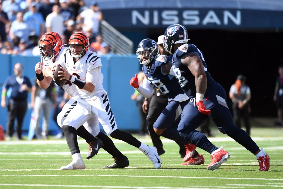 Oct 1, 2023; Nashville, Tennessee, USA; Cincinnati Bengals quarterback Joe Burrow (9) scrambles away from pressure during the second half against the Tennessee Titans at Nissan Stadium.