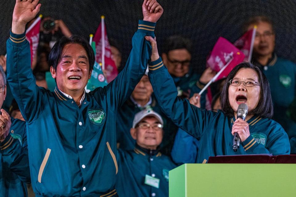 Taiwan's president, Tsai Ing-wen, right, hopes to be succeeded by Democratic Progressive Party's candidate William Lai, left. The pair are seen at a rally Thursday in  Taipei City, Taiwan. 