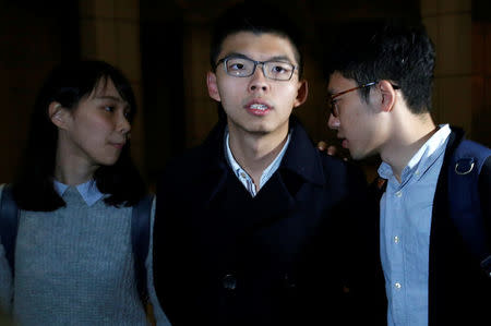 Former student leader Joshua Wong is seen accompanied by student activists Agnes Chow and Nathan Law after being released on bail at the High Court in Hong Kong, China January 23, 2018. REUTERS/Bobby Yip