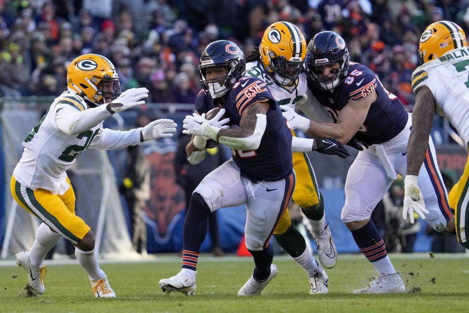 Chicago Bears' David Montgomery runs during the second half of an NFL football game against the Green Bay Packers Sunday, Dec. 4, 2022, in Chicago. (AP Photo/Nam Y. Huh)