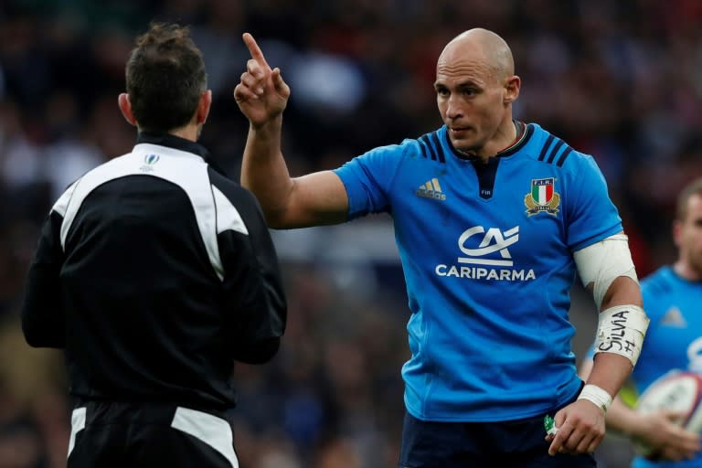 Italy captain Sergio Parisse gestures to referee Romain Poite during his side's Six Nations match against England at Twickenham in southwest London on February 26, 2017
