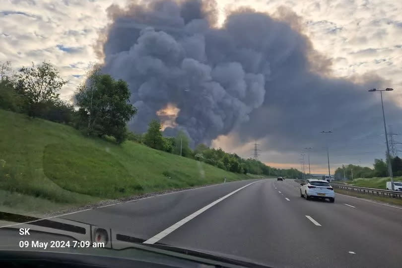 A view of huge towers of smoke over the M6 this morning from one motorist. Crews are battling a major blaze in Cannock this morning, May 9 -Credit:Sly Kov