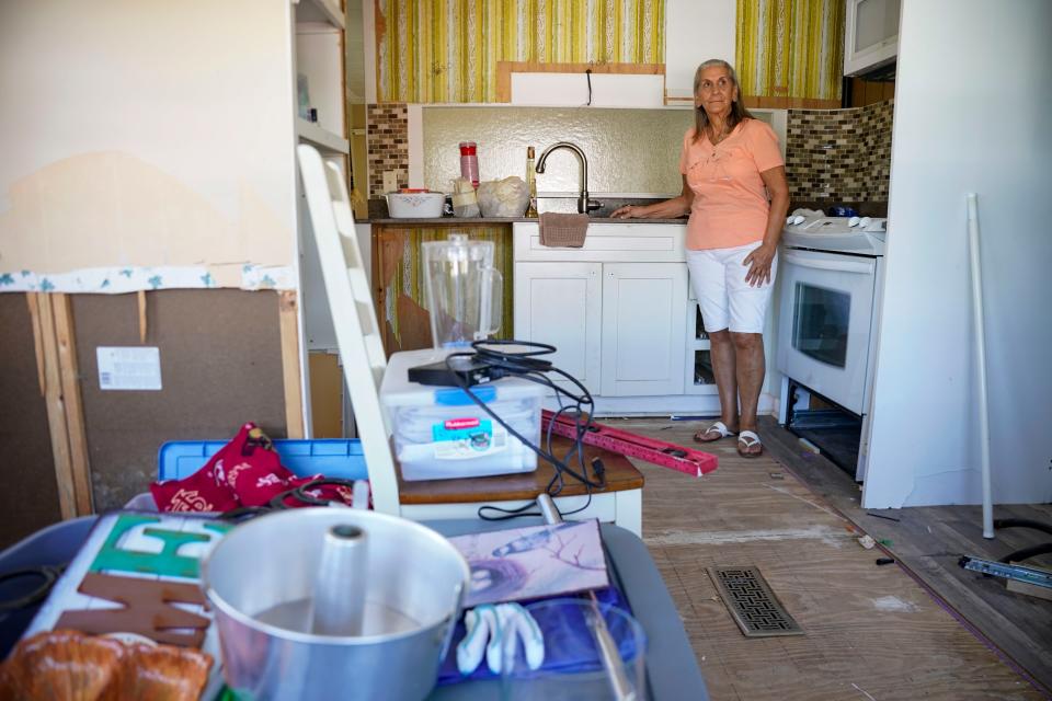 Rose Marie Powell, 83, poses inside the kitchen of the manufactured home she lived in before Hurricane Ian at Moorhead Manor in Naples on Thursday, March 2, 2023.