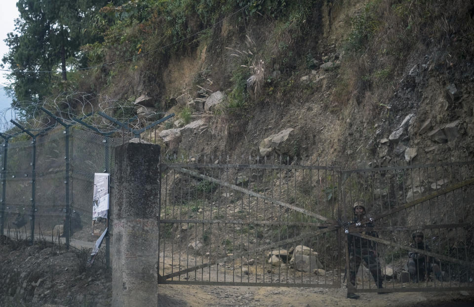 Indian army soldiers keep guard at their camp in Jakhama, outskirts of Kohima, northeastern Nagaland state, India, Sunday, Dec. 5, 2021. Angry villagers burned army vehicles in protest after more than a dozen people were killed by Indian army soldiers who mistakenly believed some of them were militants in Nagaland state, along the border with Myanmar, about 300 kilometers (186 miles) from here. Nagaland state’s top elected official ordered a probe into the killings, which occurred on Saturday. (AP Photo/Yirmiyan Arthur)