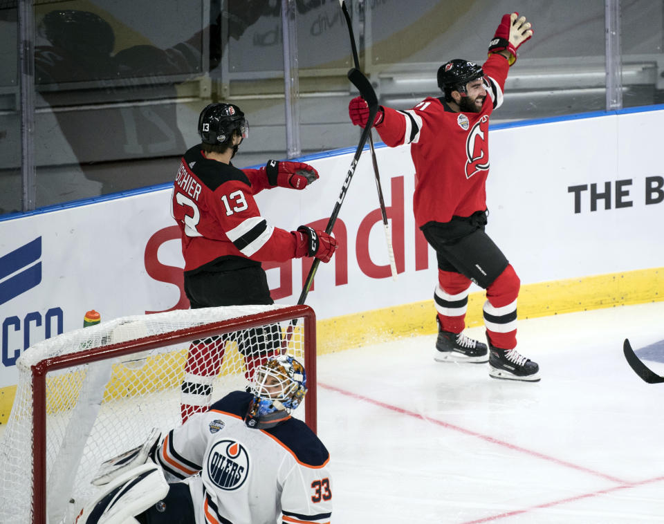 New Jersey Devils' Kyle Palmieri celebrates scoring during the season-opening NHL Global Series hockey match between Edmonton Oilers and New Jersey Devils at Scandinavium in Gothenburg, Sweden, Saturday, Oct. 6, 2018, (Bjorn Larsson Rosvall /TT News Agency via AP)