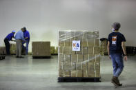 Members of Khalsa Aid USA, a global humanitarian organization, prep pallets of electrical transformers for shipping to New Delhi on New York’s Long Island, Friday, May 7, 2021. The organization will send 500 oxygen concentrators alongside the transformers to provide support for COVID-19 patients across India. (AP Photo/Jessie Wardarski)