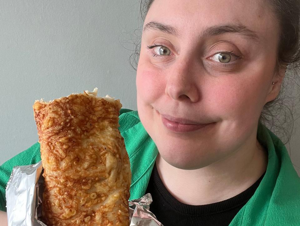 The writer poses with a chicken bake from Costco