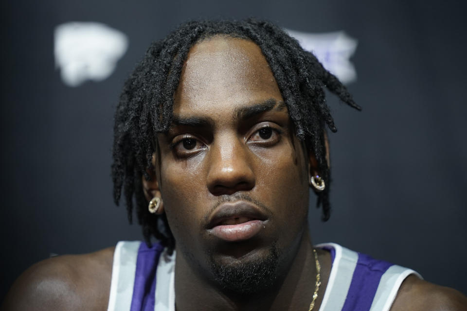 Kansas State's Arthur Kaluma speaks to the media during the NCAA college Big 12 men's basketball media day Wednesday, Oct. 18, 2023, in Kansas City, Mo. (AP Photo/Charlie Riedel)