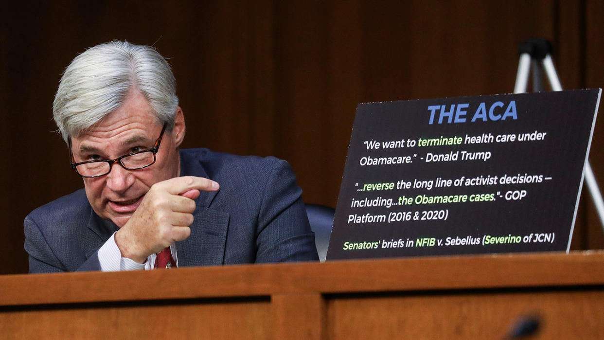 U.S. Senator Sheldon Whitehouse (D-RI) points to a chart as he speaks about efforts by conservatives who oppose the Affordable Care Act during the second day of Senate Judiciary Committee confirmation hearings for Supreme Court nominee Judge Amy Coney Barrett on Capitol Hill in Washington, U.S., October 13, 2020. (Leah Millis/Pool via Reuters)