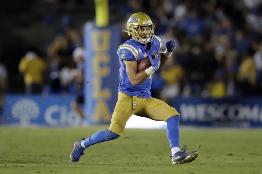 UCLA wide receiver Kyle Philips (2) runs against Arizona State during the second half.