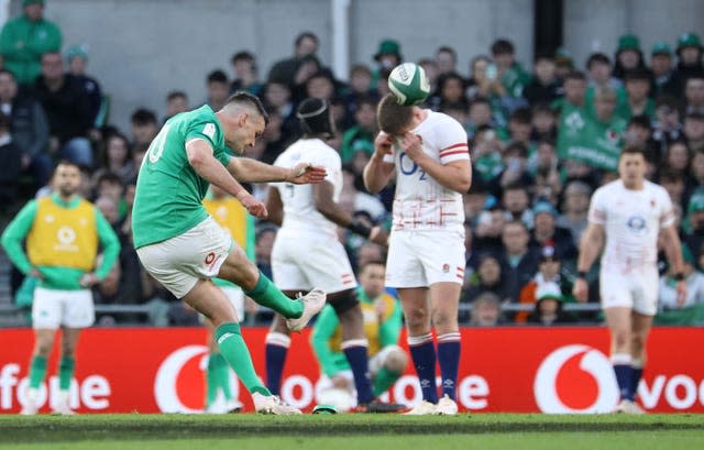 Johnny Sexton, left, kicks a penalty against England to become the Six Nations' record points scorer