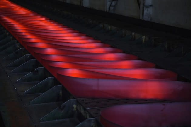 Red-hot rolled steel sits on the production line at a factory in Changzhou, China. The nation produces half the world’s crude steel—over 800 million metric tons—every year. <a href="https://www.theatlantic.com/photo/2017/01/images-of-chinas-steel-industry/512165/" rel="nofollow noopener" target="_blank" data-ylk="slk:See more photos of China’s steel industry here;elm:context_link;itc:0;sec:content-canvas" class="link ">See more photos of China’s steel industry here</a>. (Kevin Frayer / Getty)