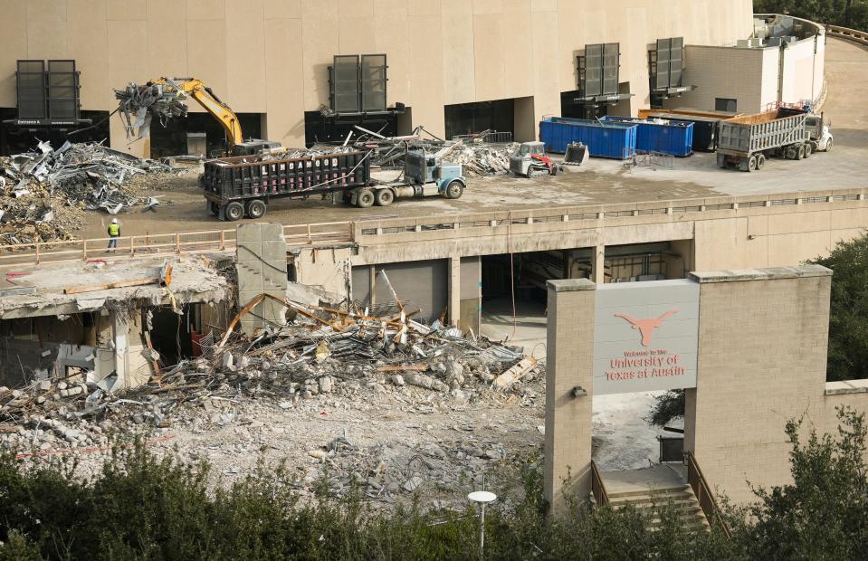 Crews work on demolishing the Erwin Center. The building served as the home for the Texas men’s and women’s basketball teams for 45 years and hosted many concerts and other events. It was replaced by the Moody Center a couple of blocks north.
