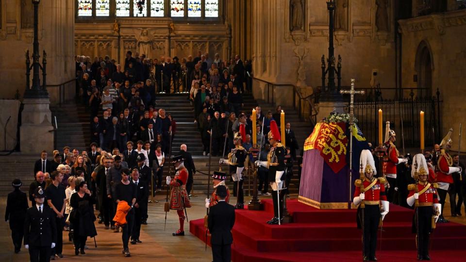 Members of the public pay their respects as the vigil begins around the Queen’s coffin (Ben Stansall/PA) (PA Wire)