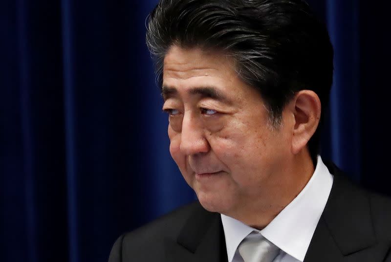 Japan's Prime Minister Shinzo Abe attends a news conference after reshuffling his cabinet at his official residence in Tokyo