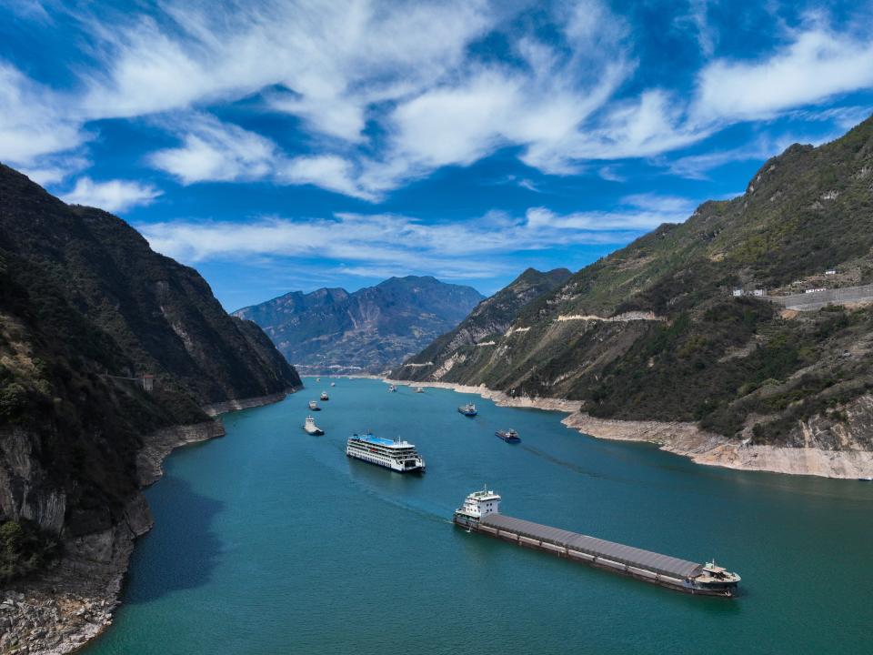 Cargo ships sail in the waters of Xiling Gorge of the Yangtze River in Zigui County, Yichang city, Central China's Hubei Province, March 14, 2023.