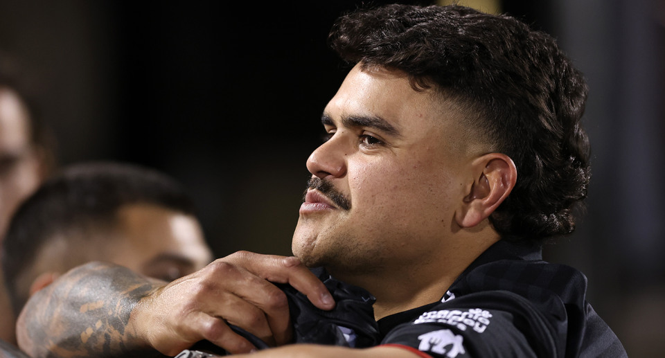 Seen here, Latrell Mitchell watches on from the stands during the Rabbitohs game against the Panthers. 