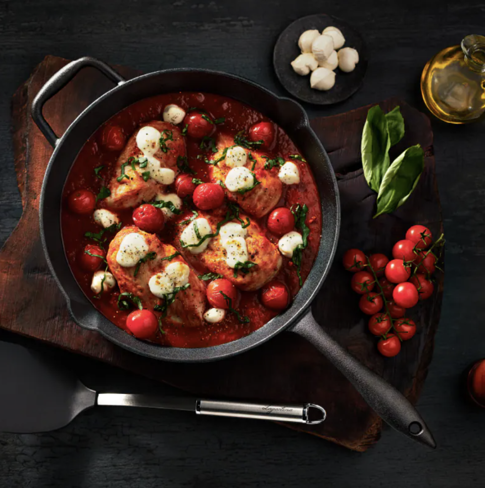 Lagostina Cast Iron Pre-Seasoned Frying Pan with cheese and tomatoes (Photo via Canadian Tire)