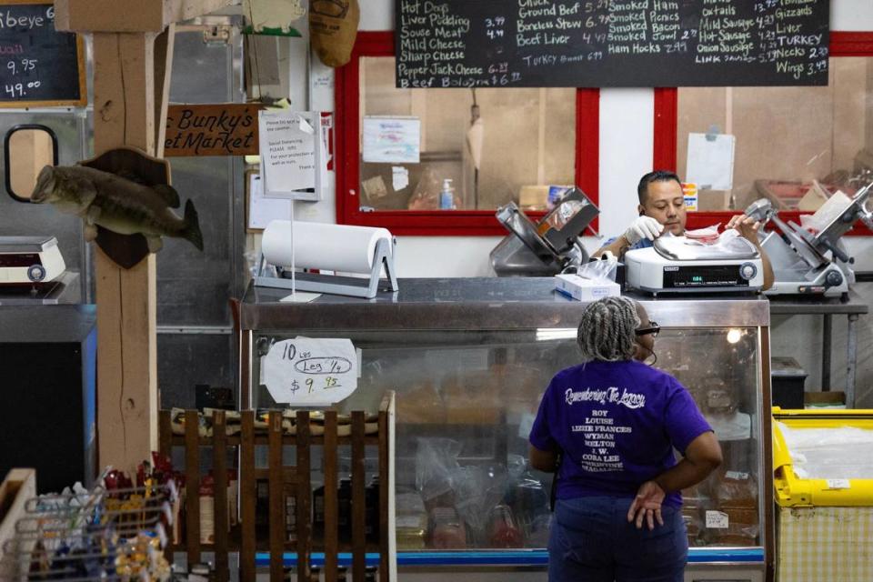 Rolo Pineda serves up meat at Mr. Bunky’s Market, in Eastover, South Carolina on Tuesday, June 18, 2024. “We’re like family here,” says Pineda.