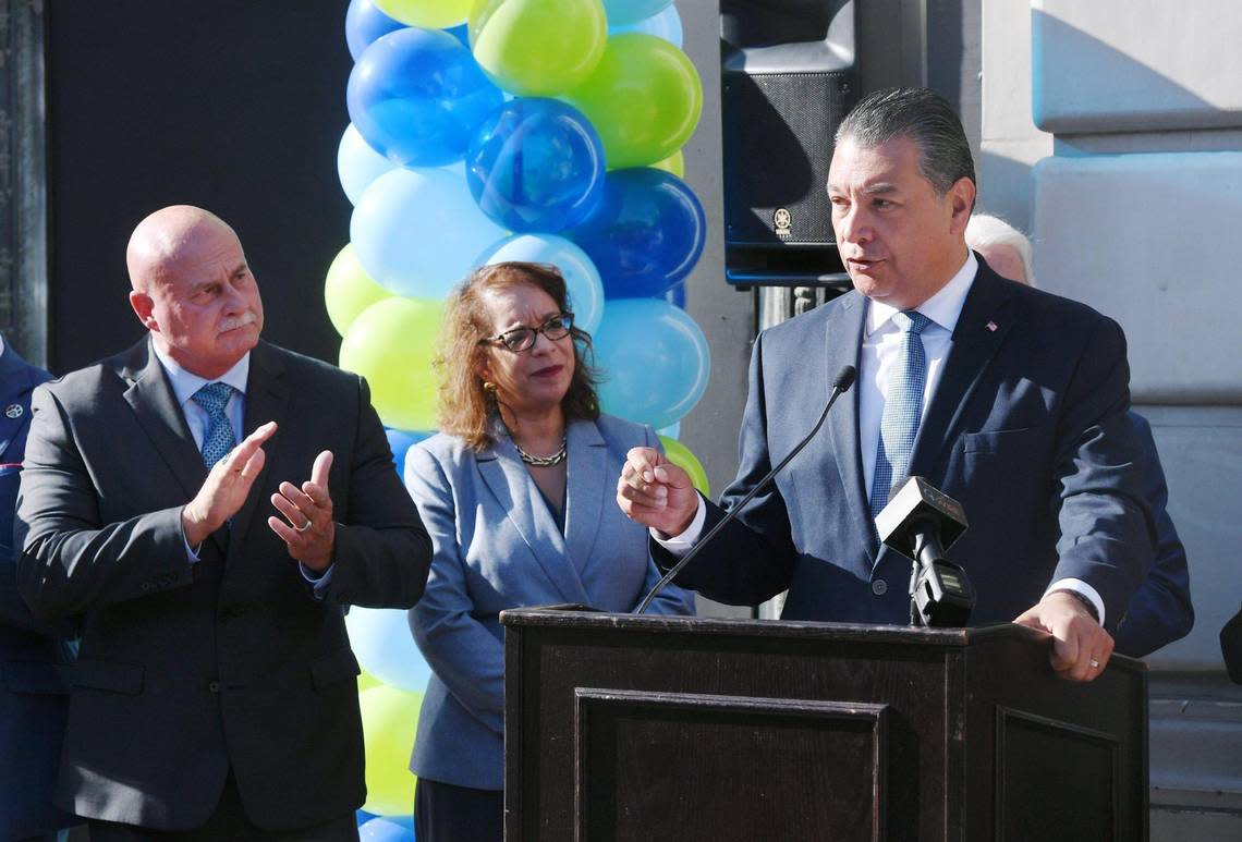 U.S. Senator Alex Padilla, right, with U.S. Assistant Secretary of Commerce Alejandra Castillo, center, and Fresno Mayor Jerry Dyer, left, leads a press conference announcing two Federal grants totaling $88.1 million Friday morning, Oct. 14, 2022 in downtown Fresno.