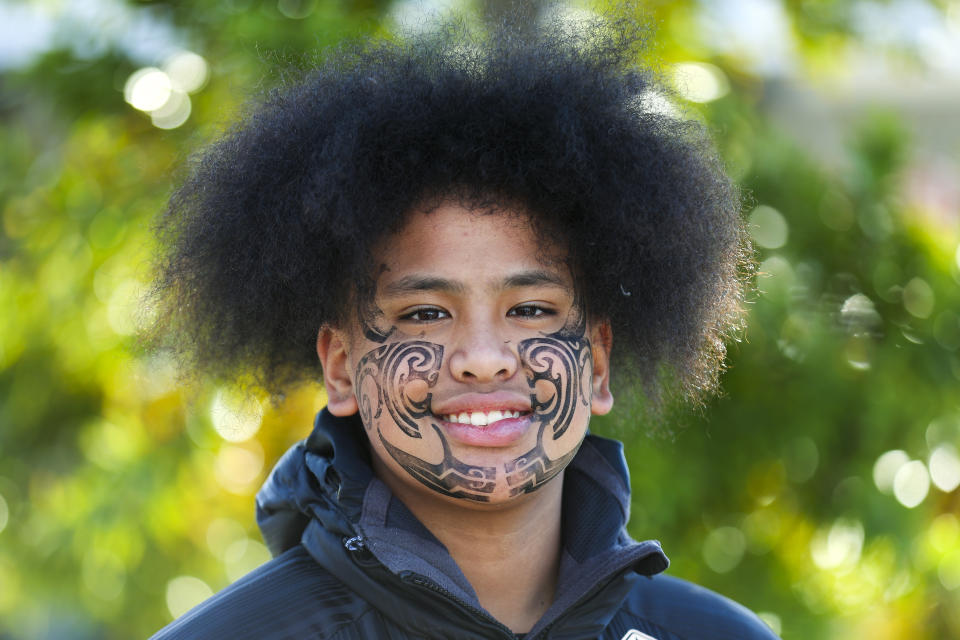 Perceus Samuels smiles after having his face painted during Matariki Whanau Day at the Wainuiomata Community Hub, Wellington, New Zealand on June 22, 2024. Now in its third year as a nationwide public holiday in New Zealand, Matariki marks the lunar new year by the rise of the star cluster known in the Northern Hemisphere as the Pleiades. (AP Photo/Hagen Hopkins)