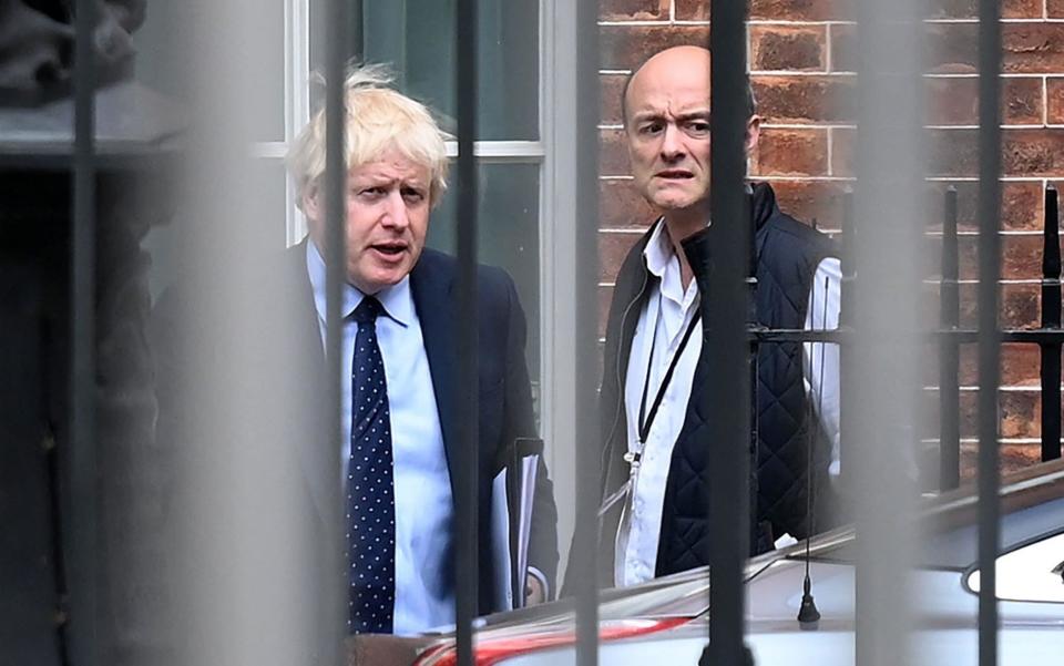 FILES) In this file photo taken on September 03, 2019 Britain's Prime Minister Boris Johnson (L) and his special advisor Dominic Cummings leave from the rear of Downing Street in central London, before heading to the Houses of Parliament. - British Prime Minister Boris Johnson faced growing scrutiny on April 25, 2021, following explosive accusations by his former chief aide Dominic Cummings earlier this week that he lacks competence and integrity. - DANIEL LEAL-OLIVAS/AFP via Getty Images