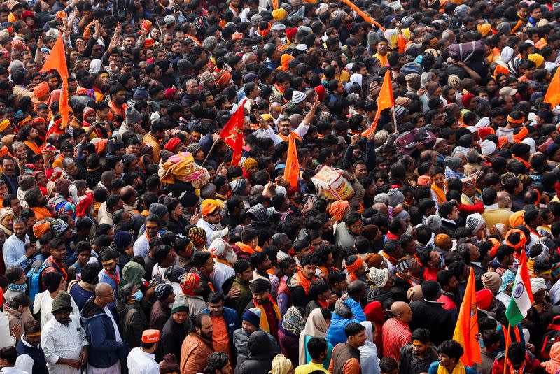 Hindu devotees struggle to enter the Hindu god Lord Ram temple after its inauguration in Ayodhya