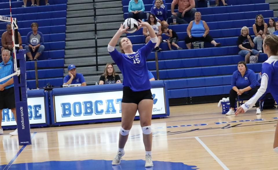 Cambridge junior Abby Mann sets the ball during Saturday's season opening match with Steubenville Catholic Central. Mann is a returning letterman who will be counted on this season by the Lady Bobcats.