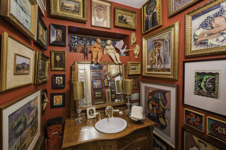 Te downstairs powder room in Robert Alter and Sherry Siegel’s home in Chicago features over five dozen works of art.