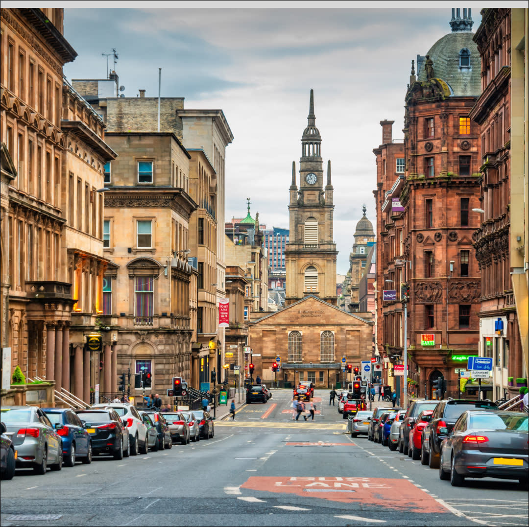  George Street with St George's Tron Church of Scotland in downtown Glasgow, Scotland. 