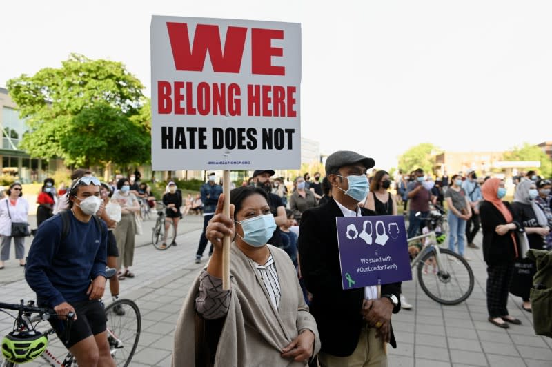 People attend a vigil in memory of a Muslim family in Montreal