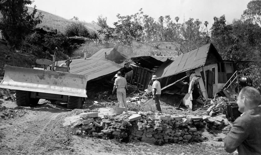 May 8, 1959: A bulldozer razes the Arechigas family home in Chavez Ravine immediately after family members, who had refused to leave, were forcibly removed. Homes were removed to make way for Dodger Stadium. Most homes in Chavez Ravine were removed in early 1950s for proposed development that fell through. Only a few homes were left in 1959 to be removed.