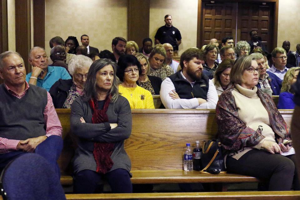 Community residents listen as a judge grants bail Curtis Flowers, whose murder conviction was overturned by the U.S. Supreme Court for racial bias, Monday, Dec. 16, 2019 in Winona, Miss. Flowers is being released from custody for the first time in 22 years. Flowers, has been tried six times for murder in the 1996 shooting deaths of four people in a furniture store. (AP Photo/Rogelio V. Solis)
