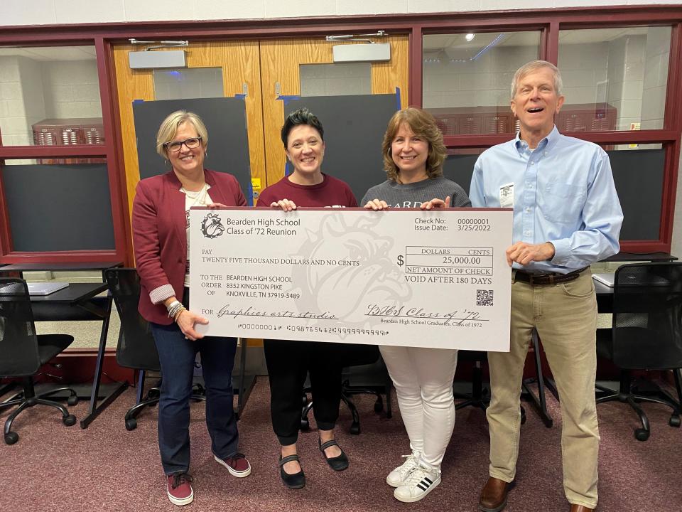 In connection with its 50th reunion, the Bearden High Class of 1972 recently made a donation of $25,000 to their alma mater to buy computers and software for the graphic arts studio. From left are Bearden principal Debbie Sayers, art and photography teacher Victoria May, art and future graphic design teacher Paula Goepfert, and 1972 Bearden graduate Les Johnston, who helped coordinate the fundraising efforts.