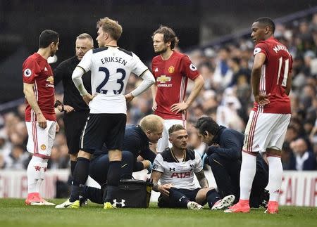 Britain Soccer Football - Tottenham Hotspur v Manchester United - Premier League - White Hart Lane - 14/5/17 Tottenham's Kieran Trippier receives medical attention after sustaining an injury Reuters / Dylan Martinez Livepic