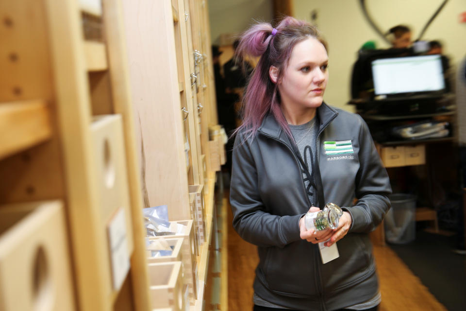 <p>An employee fulfills a marijuana order for a customer at Harborside, one of California’s largest and oldest dispensaries of medical marijuana, on the first day of legalized recreational marijuana in Oakland, Calif., Jan. 1, 2018. (Photo: Elijah Nouvelage/Reuters) </p>