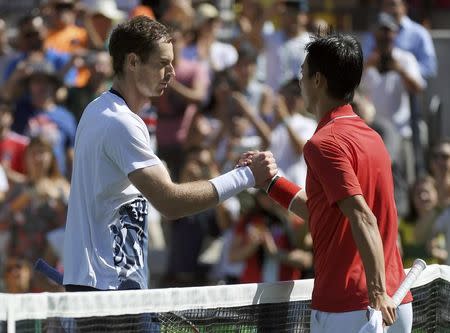 2016 Rio Olympics - Tennis - Semifinal - Men's Singles Semifinals - Olympic Tennis Centre - Rio de Janeiro, Brazil - 13/08/2016. Andy Murray (GBR) of Britain shakes hands with Kei Nishikori (JPN) of Japan after winning their match. REUTERS/Toby Melville