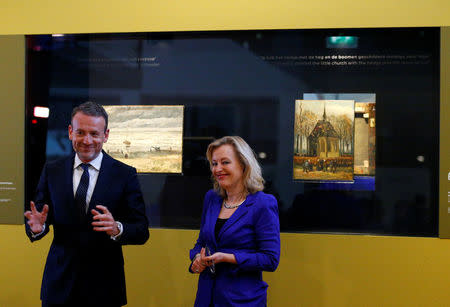 Museum director Axel Ruger and Dutch Minister of Education, Culture and Science Jet Bussemaker reveal two recovered paintings by Vincent van Gogh, which were stolen from the museum in 2002, at the van Gogh Museum in Amsterdam, Netherlands March 21, 2017. REUTERS/Michael Kooren