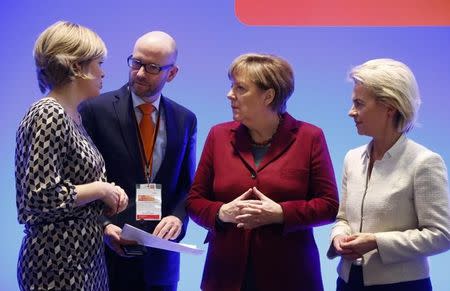 Germany's Christian Democratic Union (CDU) deputy head Julia Kloeckner, secretary general Peter Tauber, party leader Chancellor Angela Merkel, deputy head Defence Minister Ursula von der Leyen and managing director Klaus Schueler (L-R) speak during their meeting in Karlsruhe, in this file photo dated December 13, 2015. REUTERS/Ralph Orlowski