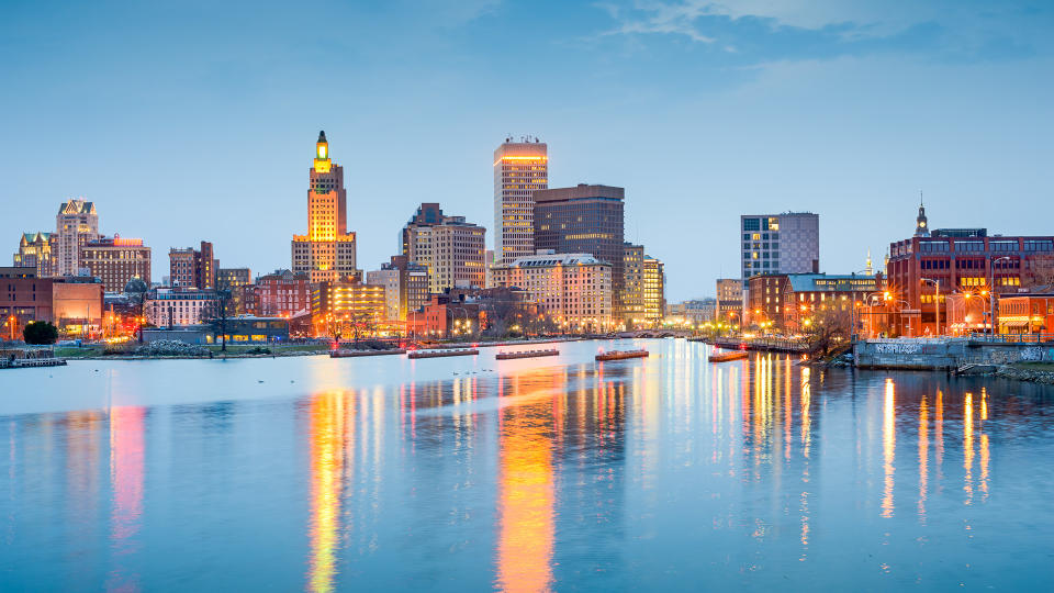 Providence, Rhode Island, USA city skyline on the Providence River at twilight.