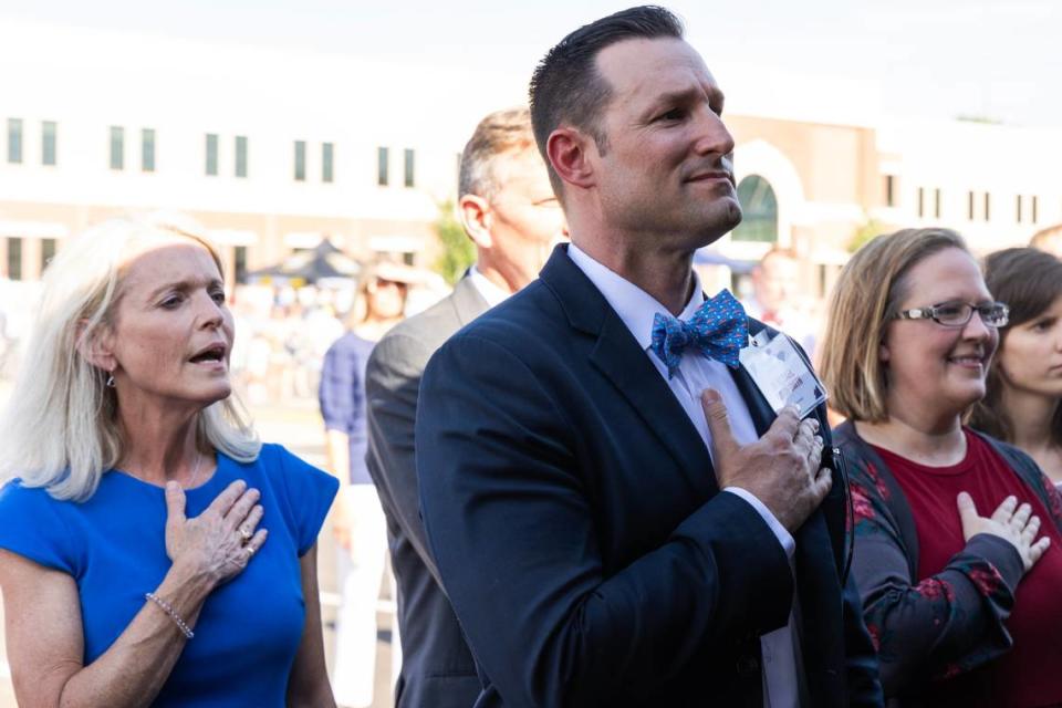 American Leadership Academy Lexington School Leader Michael Gordon Smith listens to the Pledge of Allegiance during a ceremony at the school’s grand opening on Thursday, August 10, 2023. Joshua Boucher/jboucher@thestate.com