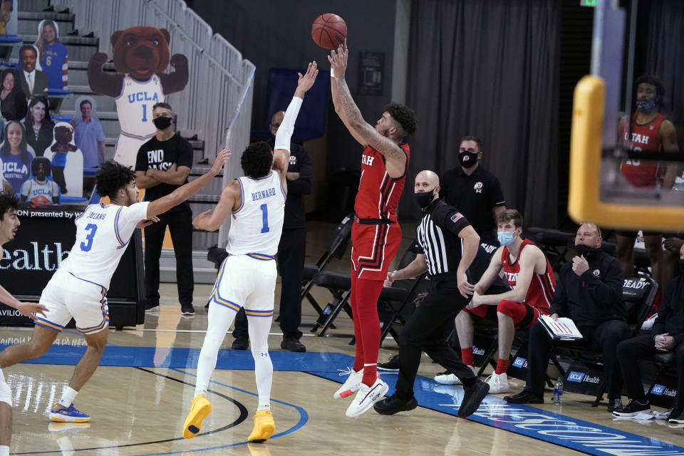 Utah forward Timmy Allen shoots over UCLA guard Jules Bernard (1) during the second half of an NCAA college basketball game Thursday, Dec. 31, 2020, in Los Angeles. (AP Photo/Marcio Jose Sanchez)